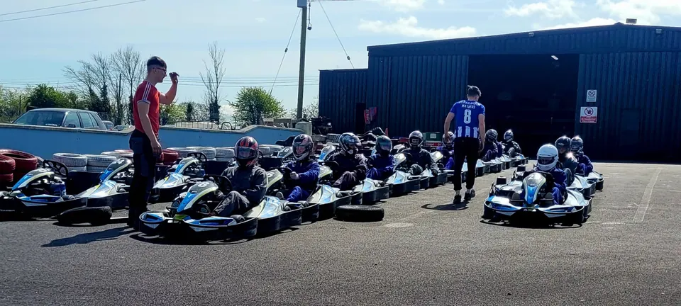 Club members lined up in karts on the grid at a karting day